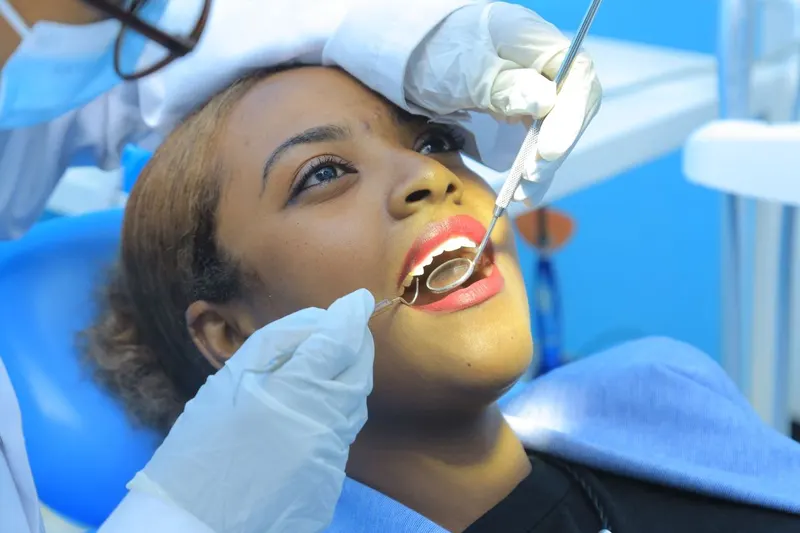 Patient receiving a dental examination at Dr. Akalewold Dental Clinic